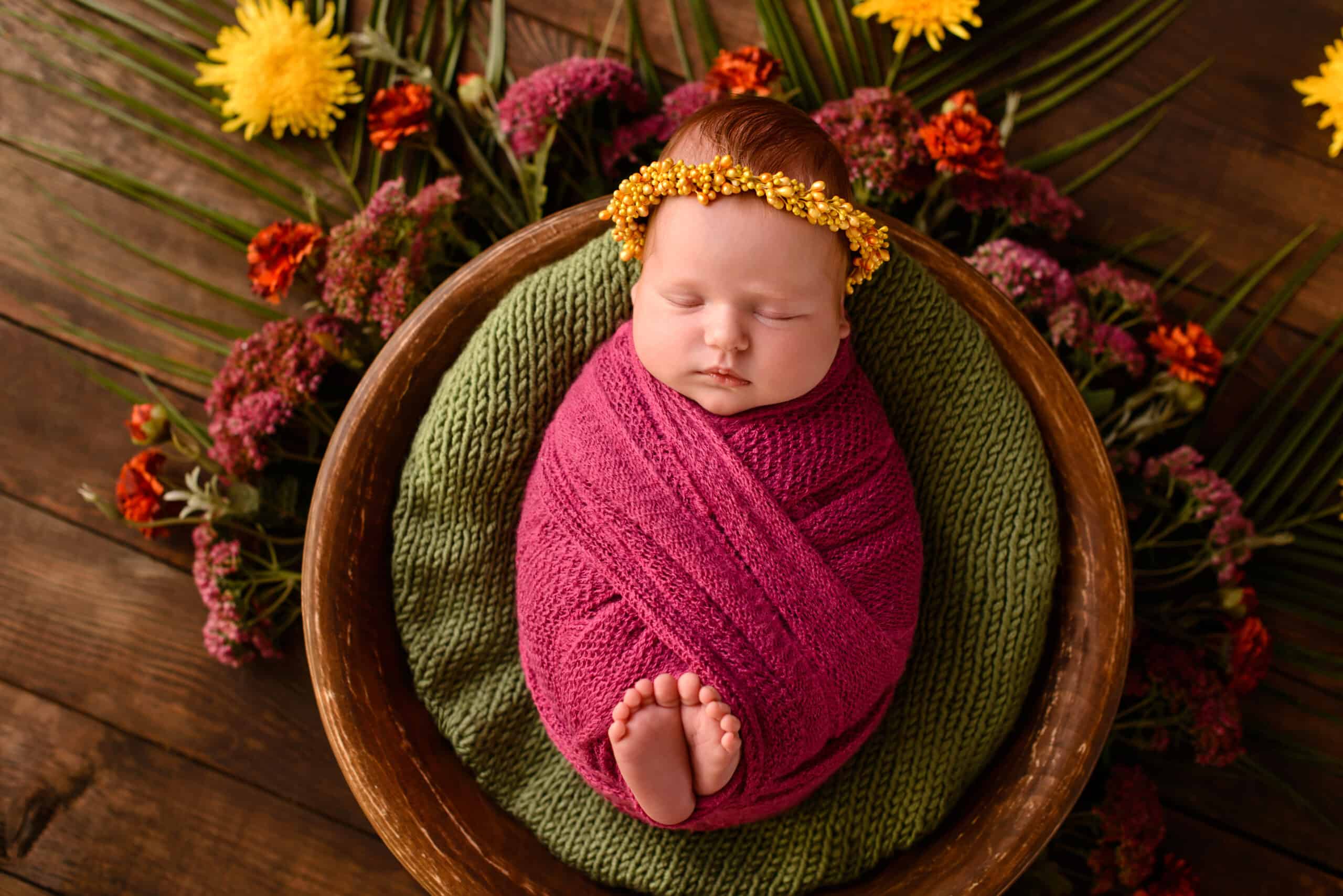First photo session newborn baby. newborn. the child lies on a purple blanket